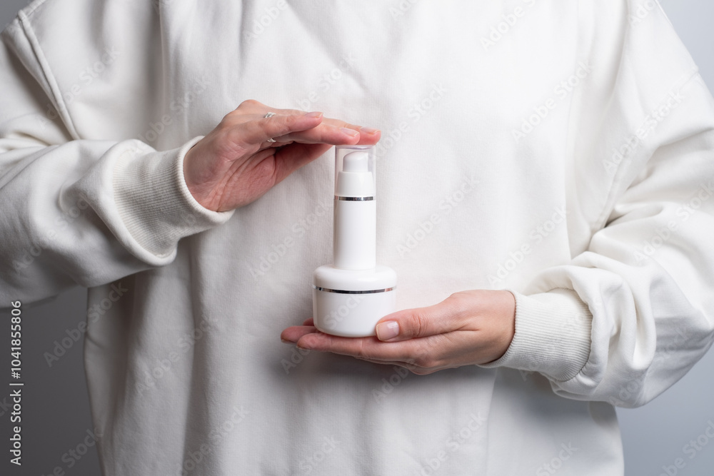 A jar of spa cream in the hands of a girl. Skin care. Medical and dermatological cosmetics for hands. Beauty and health of a woman. Spa treatments for the body. Container with natural cream close-up A jar of spa cream in the hands of a girl. Skin care. Medical and dermatological cosmetics for hands. Beauty and health of a woman. Spa treatments for the body. Container with natural cream close-up