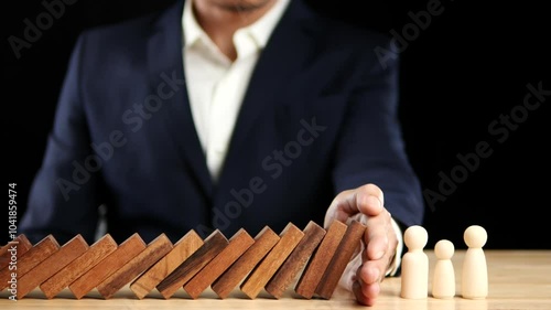 Risk, Business Risk Management, Economic, Financial Crisis Concept. Business man stop wooden block domino effect to safe, protect family, home from crisis. Concept Risk, Insurance. Slow Motion