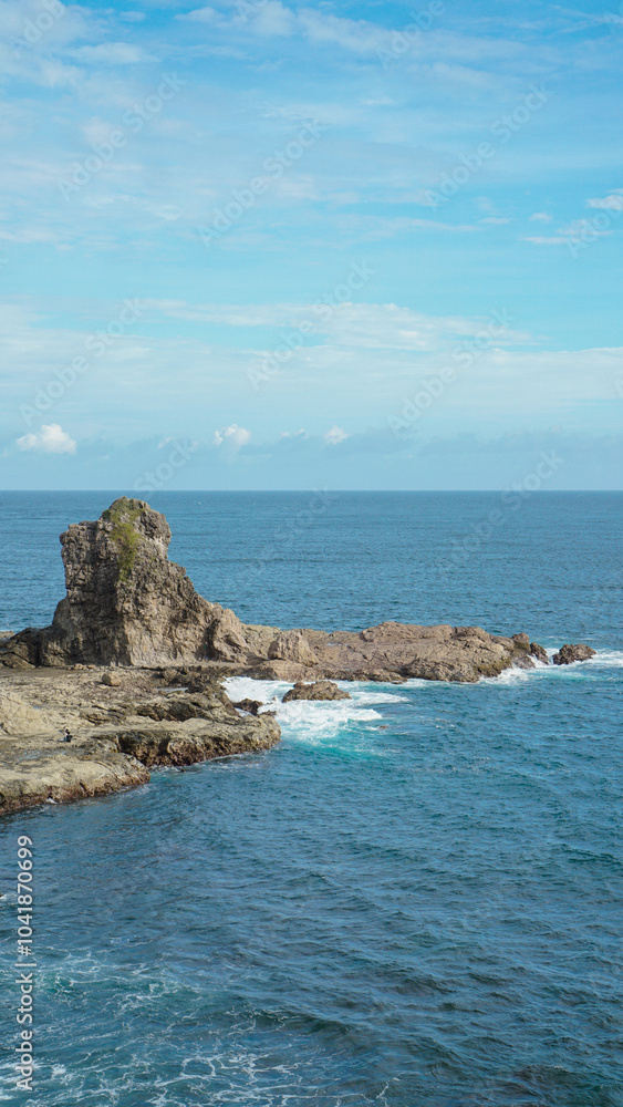 top view of watu lumbung beach, indonesia. blue transparant sea and rock. travel photo top view of watu lumbung beach, indonesia. blue transparant sea and rock. travel photo