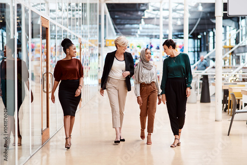 Business people, group and walking with discussion in office for creative project, planning and meeting. Startup, company and women in consultation with manager for collaboration, advice and feedback