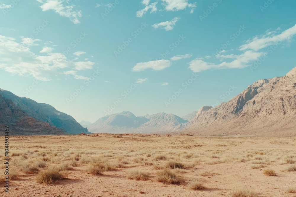 Naklejka premium Vast Desert Landscape with Mountains and Blue Sky