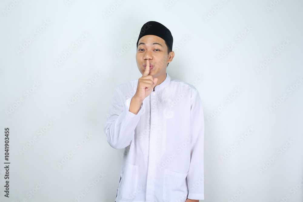attractive muslim man asian show silent gesture isolated on white background attractive muslim man asian show silent gesture isolated on white background