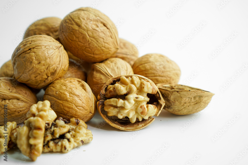 Ripe dry split walnut. Walnuts Isolated on White Background. closeup of shelled organic walnut halves. walnut, nut, full depth of field Ripe dry split walnut. Walnuts Isolated on White Background. closeup of shelled organic walnut halves. walnut, nut, full depth of field