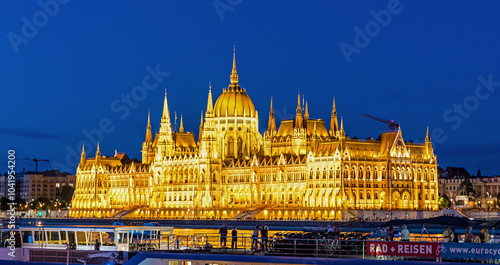 Hungarian Parliament at Night Along Danube River in Pest in Budapest, Hungary. photo