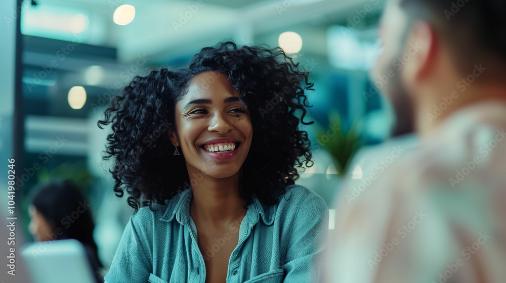 A joyful woman with curly hair engages in friendly conversation at a modern café during the afternoon hours with a lively atmosphere A joyful woman with curly hair engages in friendly conversation at a modern café during the afternoon hours with a lively atmosphere