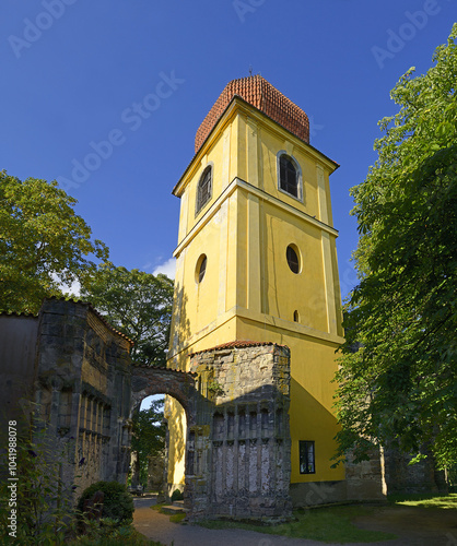 Obraz na płótnie The unfinished Church of the Virgin Mary is an unfinished high-Gothic building with a completed Baroque bell tower from a later period in Panensky Tynec, Bohemia, Czech Republic. w salonie