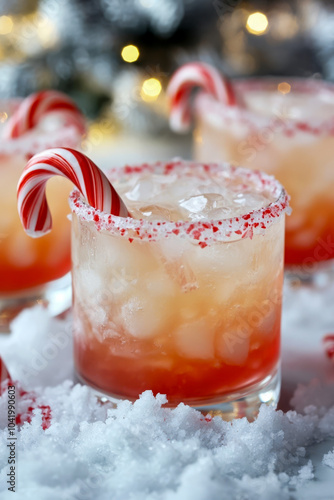 Refreshing holiday cocktail topped with crushed candy cane rim and garnished with a candy cane, set in a snowy, festive atmosphere