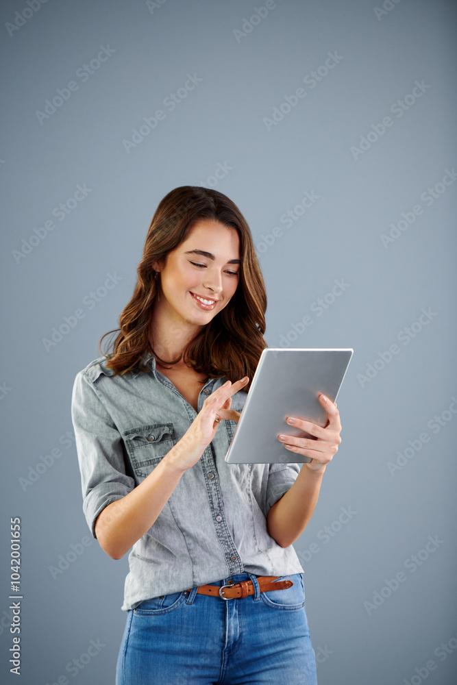 Studio, happy and woman with research on tablet for online banking, application or information. Network, connection and person with tech for digital shopping, platform or ecommerce by gray background Studio, happy and woman with research on tablet for online banking, application or information. Network, connection and person with tech for digital shopping, platform or ecommerce by gray background
