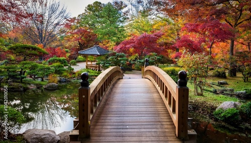 wooden bridge in serene japanese garden setting anderson japanese gardens rockford illinois usa autumn foliage surrounding tranquil pond water features and rich plants