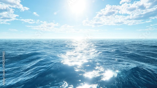 Deep blue sea surface with soft waves, reflecting the light of a bright sky, giving a peaceful vibe.