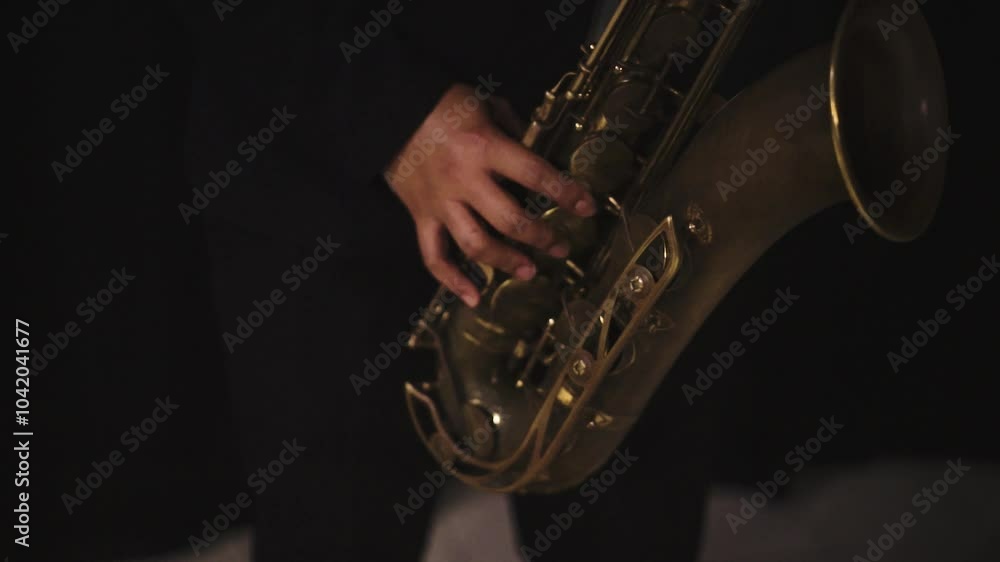 close up cinematic elegant musician playing Saxophone with black background 