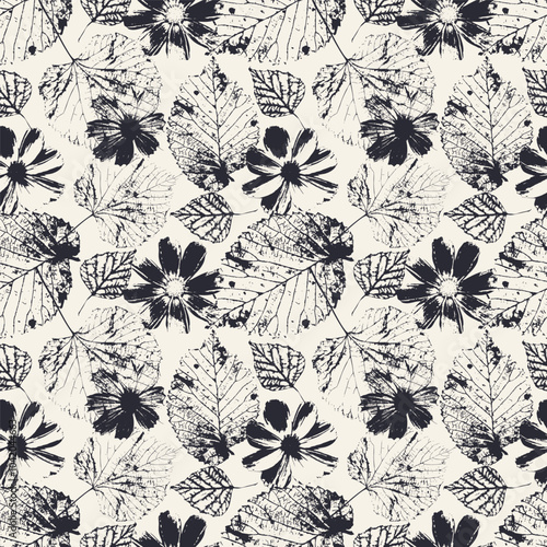 Seamless pattern with monochrome tree leaves and cosmos flowers stamps. Nature grunge background. Floral inky repeat design.