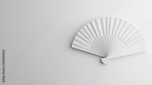 Minimalistic hand fan mockup design featuring a white folding fan against a seamless white background.