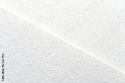 Minimalist white paper texture background for design projects and creative inspiration.