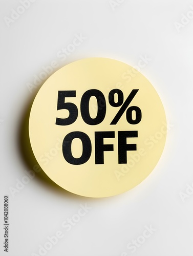 Black '50% OFF' Text on a Light Yellow Round Paper Note. White Background 