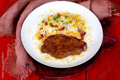 Authentic Brazilian food, grilled picanha steak with birobiro rice photo