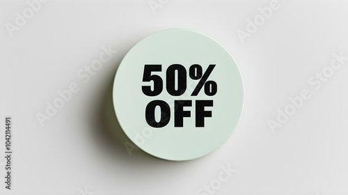 Black '50% OFF' Text on a Light Green Round Paper Note. White Background with Copy Space