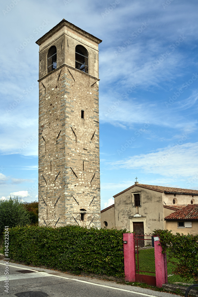 Fototapeta premium Stone, monumental church with bell tower on Lake Garda