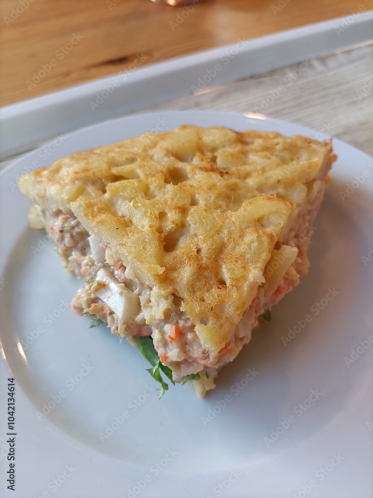 Potato omelette stuffed with ensaladilla. Potato omelette stuffed with ensaladilla.