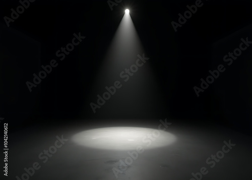 A minimalist theater stage with clean black walls, a single spotlight shining on the empty floor, creating an intense and focused atmosphere.