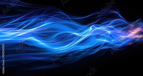 Abstract blue light streaks flowing in a dynamic pattern across a dark background, creating a fluid and energetic visual effect. photo