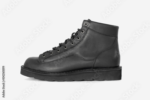 Black leather boots on white background. Fashion