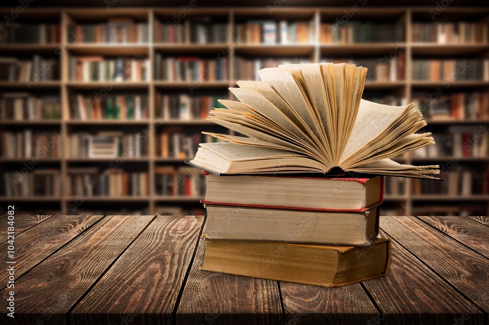 Fototapeta premium Reading Books set on wooden table in library