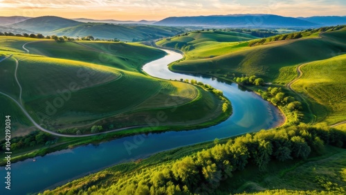 Wallpaper Mural Breathtaking aerial view of rolling green hills and a winding river at sunset, perfect for nature, travel, or outdoor adventure themes Torontodigital.ca