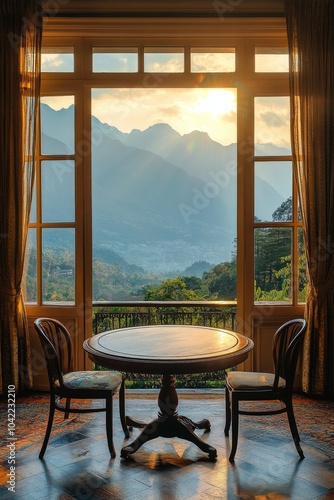 Cozy dining area with a stunning mountain view in a winter landscape during d...