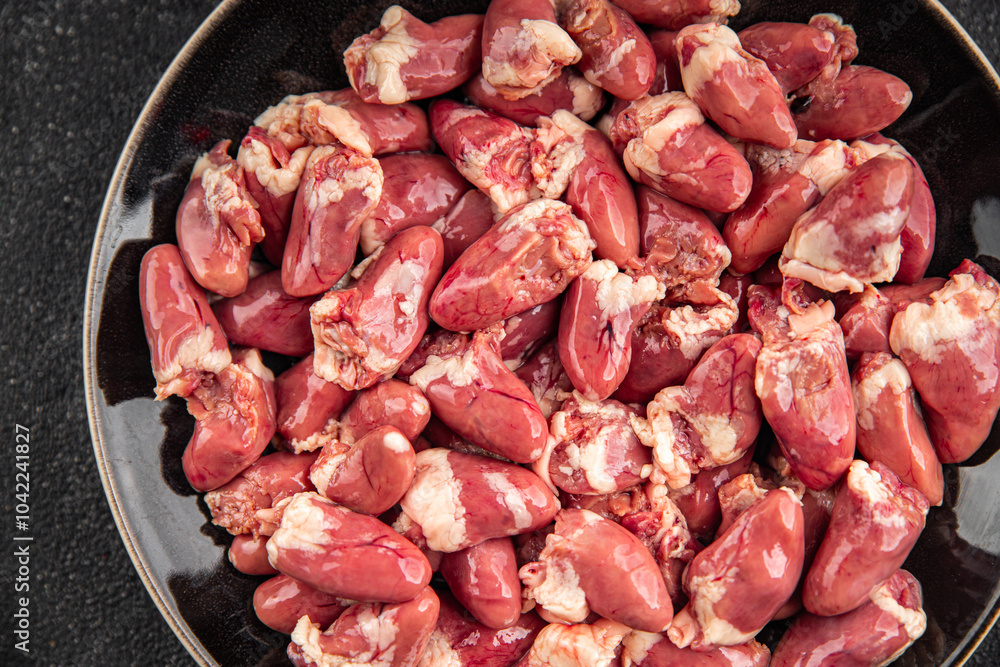 Chicken heart raw chicken offal tasty food dish Fresh delicious gourmet food background on the table rustic food top view copy space top view keto and paleo diet Chicken heart raw chicken offal tasty food dish Fresh delicious gourmet food background on the table rustic food top view copy space top view keto and paleo diet