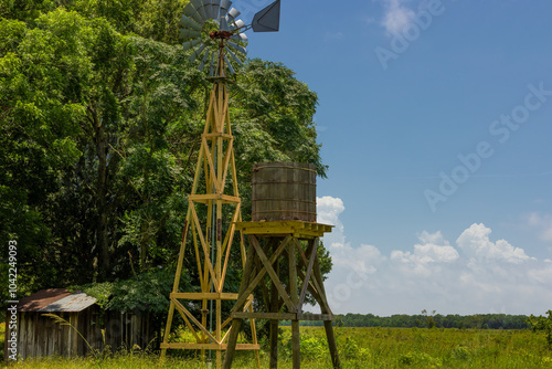 Agricultural landscape with windmill and Cistern at Armand Bayou Nature Park in Pasadena, Texas, USA