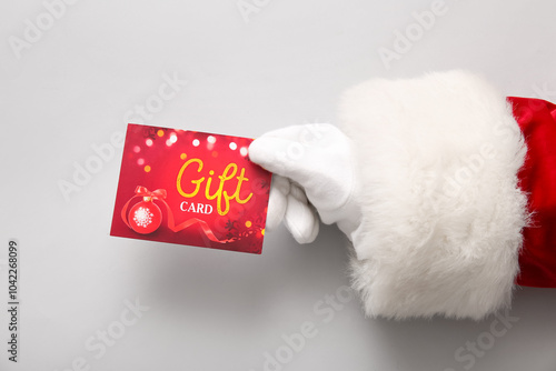 Wallpaper Mural Santa hand with gift card on grey background, closeup Torontodigital.ca