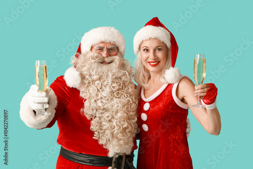 Εκτύπωση καμβά Santa and MRS Claus with glasses of champagne on blue background