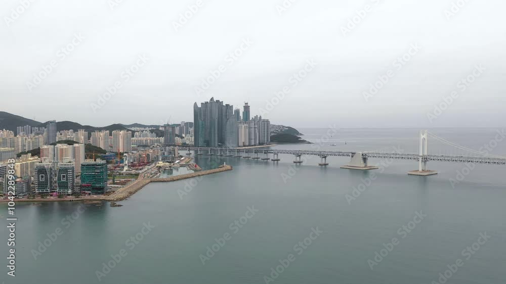 BUSAN, SOUTH KOREA - OCTOBER 19, 2024: Aerial view of the coastal skyline and Gwangan Bridge in Busan showcasing urban development and beauty BUSAN, SOUTH KOREA - OCTOBER 19, 2024: Aerial view of the coastal skyline and Gwangan Bridge in Busan showcasing urban development and beauty