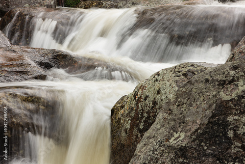 The Big Thompson River rushes over boulders creating numerous small falls within Rocky Mountain National Park, Colorado in mid-July photo