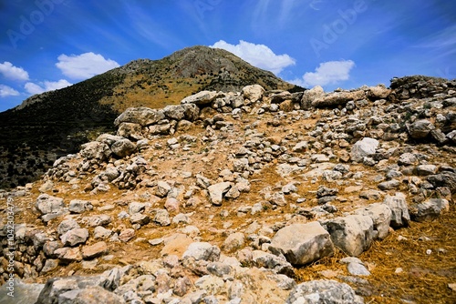 Remains of the fortification walls of Mycenae on Peloponnese in Greece. Mycenae was one of the largest citadels in Ancient Greece during the Bronze Age and played an important role in the Trojan War photo