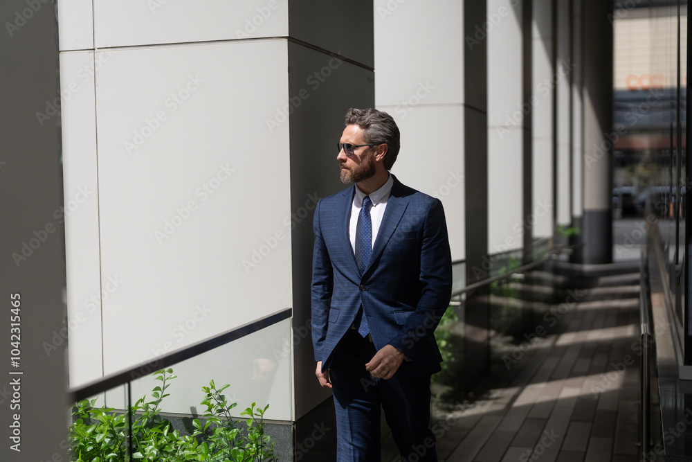 New opportunities. Businessman in office building. Successful business boss. Businessman in suit. Business man passing modern office. Handsome man CEO. Successful future vision New opportunities. Businessman in office building. Successful business boss. Businessman in suit. Business man passing modern office. Handsome man CEO. Successful future vision
