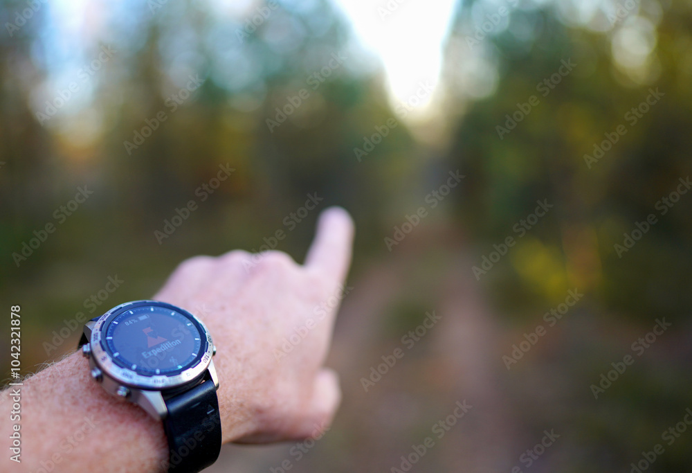 Smartwatch travel. Hiker with sports watch in Expedition. Watch in wild survival. Outdoor, hiking Watch on hand with glove. GPS track Smartwatch. Traveler watch in adventure. Hand Pointing Direction. Smartwatch travel. Hiker with sports watch in Expedition. Watch in wild survival. Outdoor, hiking Watch on hand with glove. GPS track Smartwatch. Traveler watch in adventure. Hand Pointing Direction.
