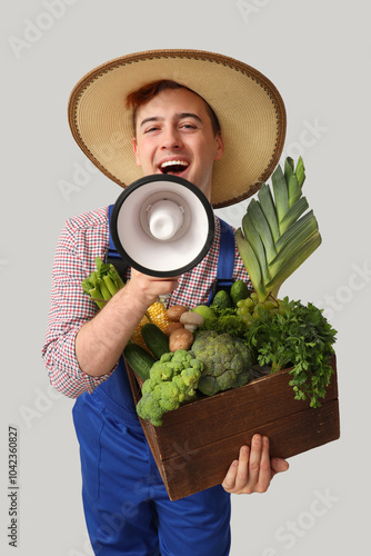 Male farmer with box of veg...