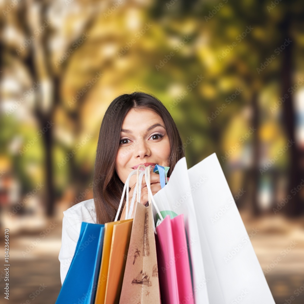 Portrait of happy woman posing with shopping bags Portrait of happy woman posing with shopping bags