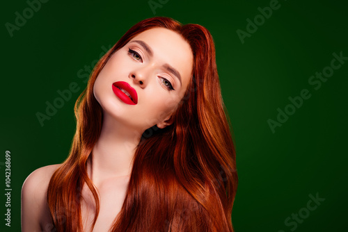 Photo of pretty lady look feel tempting having long shiny healthy red ginger hair isolated green color background