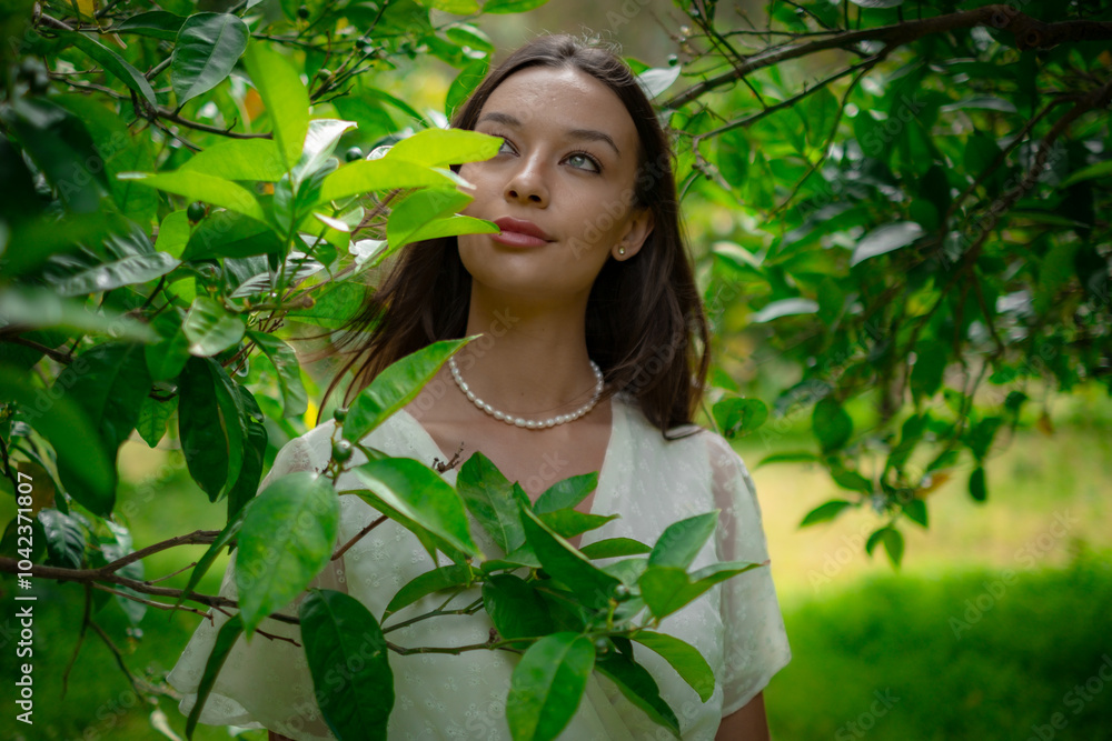 A woman peacefully walking between vibrant lemon trees, enjoying the fresh, natural surroundings, creating a calm and serene atmosphere in a garden. A woman peacefully walking between vibrant lemon trees, enjoying the fresh, natural surroundings, creating a calm and serene atmosphere in a garden.