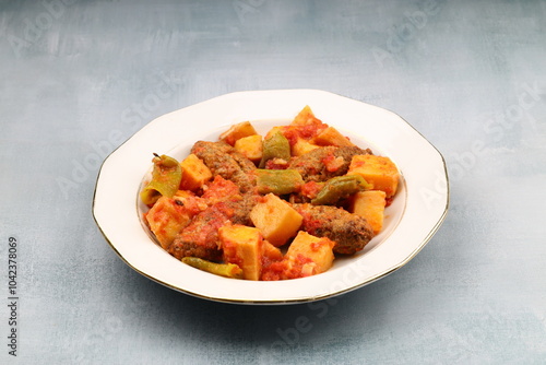 Traditional Homemade Turkish Food Kofte - Kofta with Tomato Sauce and Potatoes. (Turkish name; Izmir kofte) photo