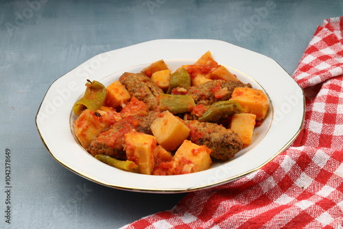 Traditional Homemade Turkish Food Kofte - Kofta with Tomato Sauce and Potatoes. (Turkish name; Izmir kofte) photo