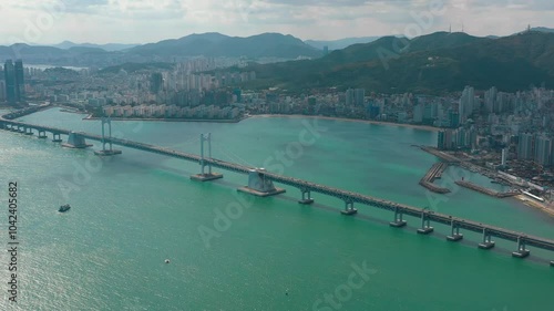 Wallpaper Mural BUSAN, SOUTH KOREA - OCTOBER 19, 2024: Stunning aerial view of the Busan bridge and coastline showcasing waterfront development and cityscape Torontodigital.ca