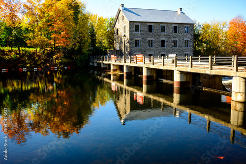 Watson's Mill an historic flour and gristmill built of quarried limestone in Manotick, Ontario, on the Rideau canal outside ottawa in fall photo