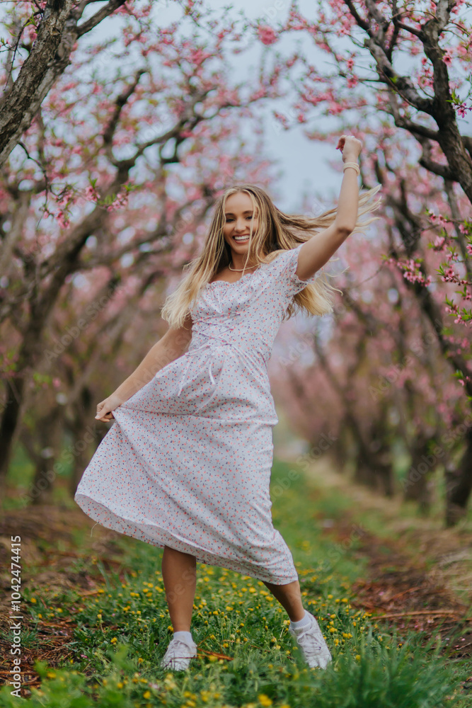 Girl in a pink floral dress in a spring orchard 4 Girl in a pink floral dress in a spring orchard 4