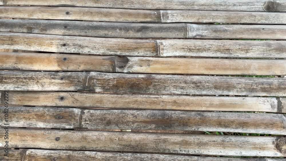 Bamboo slat arrangement background, texture, bamboo slats, upright type. natural brown color. the color of weathered bamboo wood Bamboo slat arrangement background, texture, bamboo slats, upright type. natural brown color. the color of weathered bamboo wood