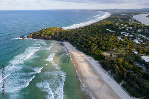 Aerial views of Fingal Head Lighthouse with the causeway rock formations below in Fingal Head, New South Wales, Australia photo