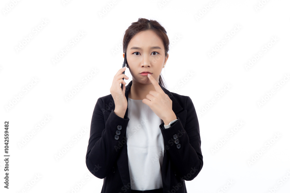 Portrait young asian businesswoman in suit thinking while talking on smartphone with doubt isolated white background, business woman thoughtful while speaking on smart phone with expression pondering. Portrait young asian businesswoman in suit thinking while talking on smartphone with doubt isolated white background, business woman thoughtful while speaking on smart phone with expression pondering.